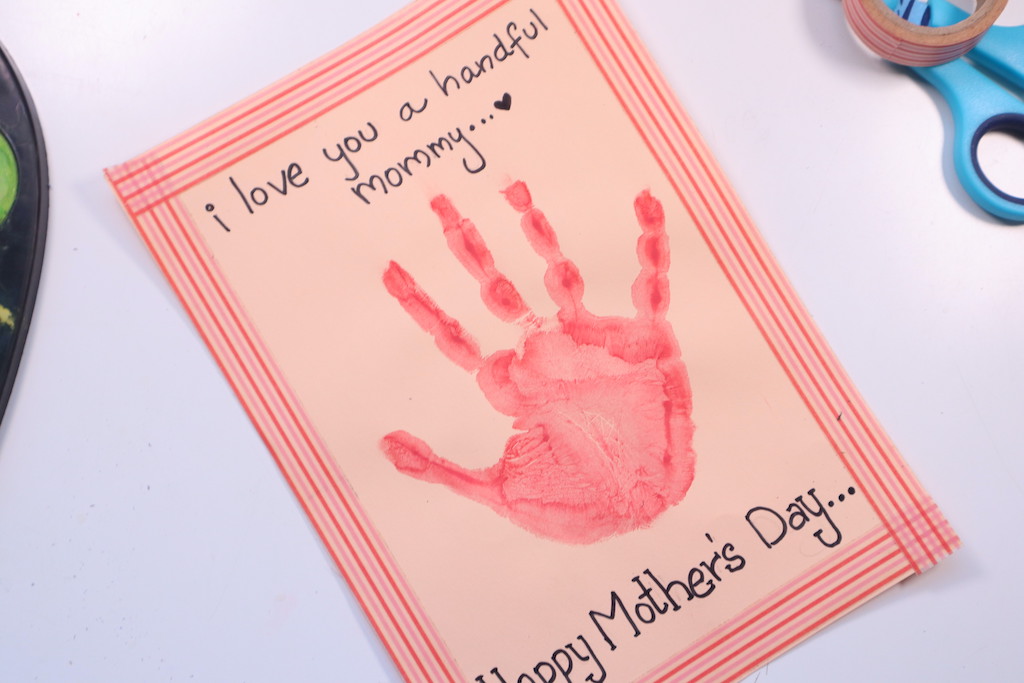 Mother's Day handprint card idea for kids - apply paint to your child's hand and make the handprint